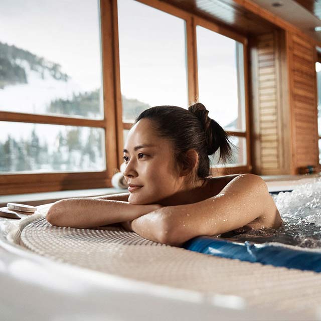 asian lady relaxing in a jacuzzi