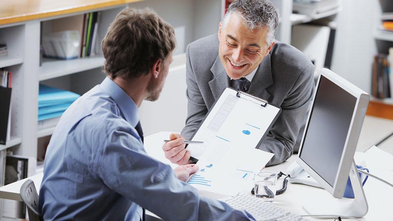 Two man in a discussion of a plan