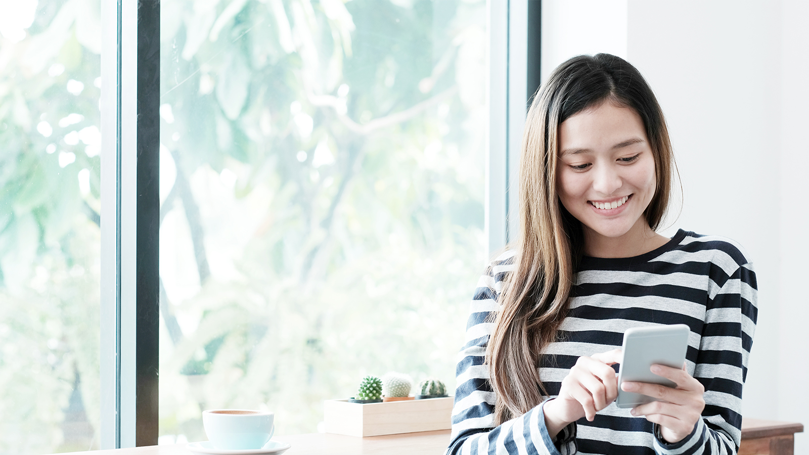 lady smiling using phone