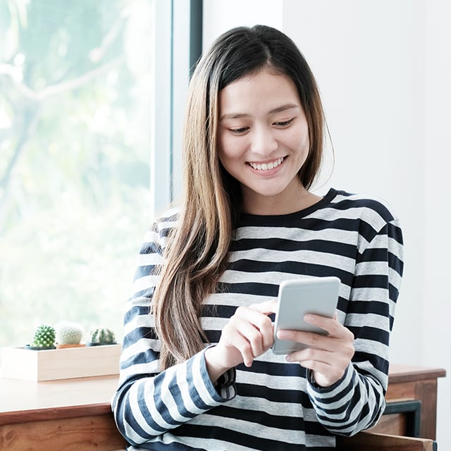 lady smiling using phone